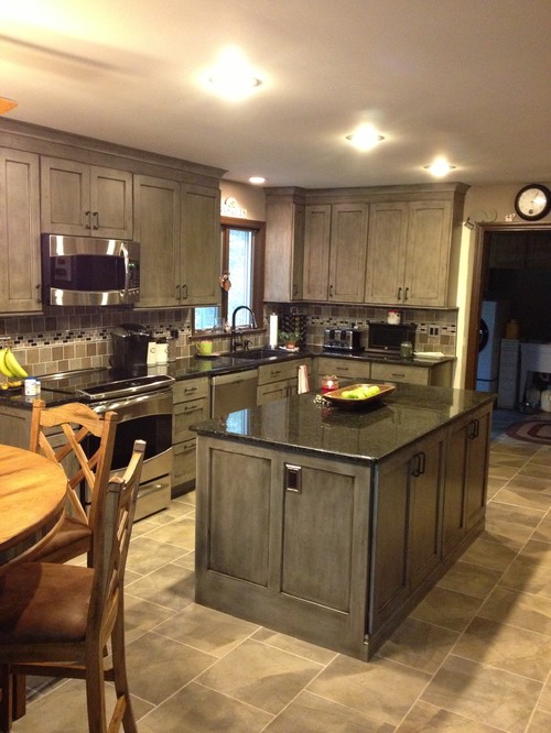 Gray Cabinets, Natural Stone and Glass Backsplash, with Uba Tuba Granite